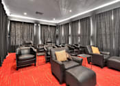 Thumbnail 53 of 57 - a large screening room with leather chairs and curtains
