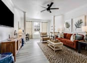 Thumbnail 6 of 50 - A living room with a leopard print rug and a red couch.