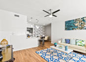 Thumbnail 13 of 57 - a living room with a couch and a ceiling fan