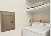 Thumbnail 29 of 57 - a white washer and dryer in a room with a dryer and shelf