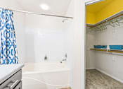 Thumbnail 27 of 57 - a bathroom with a tub and a shower and a sink