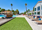 Thumbnail 39 of 57 - a row of lounge chairs next to a pool at a resort