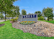 Thumbnail 13 of 15 - A stone wall with a sign that says Crest.