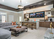 Thumbnail 6 of 31 - A clubroom area with entertainment and ample seating.