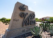 Thumbnail 35 of 41 - A stone sign for The San Vista at Zaragoza with a blue sky in the background.