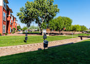 Thumbnail 25 of 41 - A grassy area with a mailbox and a tree in the foreground.