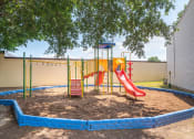 Thumbnail 1 of 13 - a playground with a playset and a tree