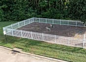 Thumbnail 9 of 30 - a fenced in backyard with chickens in it