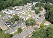 Thumbnail 13 of 30 - an aerial view of a neighborhood with houses and parking lot