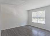 Thumbnail 22 of 30 - an empty room with white walls and a window