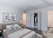 Thumbnail 19 of 30 - a bedroom with a bed and a closet