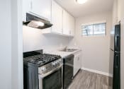 Thumbnail 10 of 32 - Fully Furnished Kitchen With Stainless Steel Appliances at Arbor Pointe at Hillcrest, Little Rock, AR