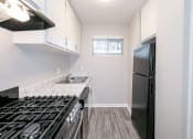 Thumbnail 7 of 32 - Fully Equipped Kitchen With Modern Appliances at Arbor Pointe at Hillcrest, Little Rock, AR, 72205