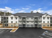 Thumbnail 45 of 50 - attached garages and parking spaces at Tapestry Overbrook in McDonough, Georgia
