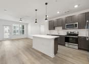 Thumbnail 2 of 50 - open floor plan with large kitchen island at Tapestry Overbrook in  McDonough, Georgia