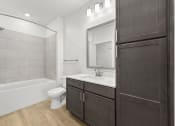 Thumbnail 7 of 50 - a bathroom with wood style flooring at Tapestry Overbrook in McDonough, Georgia
