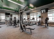 Thumbnail 4 of 34 - a large fitness room with treadmills and other exercise equipment