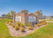 Thumbnail 34 of 34 - a stone monument with a sign that reads the winery in front of a grassy area