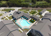 Thumbnail 31 of 34 - an aerial view of the resort style pool and tennis courts