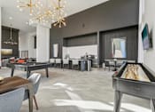 Thumbnail 28 of 39 - a game room with pool table and coffee lounge at Tapestry Headwaters in Kissimmee, FL