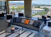 Thumbnail 20 of 29 - Rooftop entertainment area with electric grills at Flats on 4th Apartments in Birmingham, AL