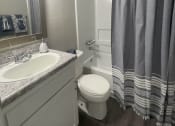Thumbnail 21 of 22 - updated bathrooms with wood floors at Midtown Oaks Townhomes in Mobile, AL