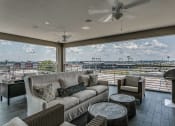 Thumbnail 3 of 29 - Rooftop entertainment area with electric grills at Flats on 4th Apartments in Birmingham, AL