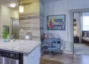 Thumbnail 5 of 54 - Modern Kitchen with Stainless Appliances at 4700 Colonnade Apartments in Birmingham, AL