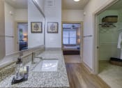 Thumbnail 14 of 54 - Modern Bathroom with Wood look floors and walk in closets