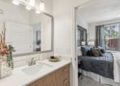 Thumbnail 13 of 39 - a bedroom with en-suite bathroom at Tapestry Headwaters Apartments in Kissimmee, FL