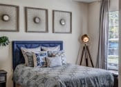 Thumbnail 14 of 35 - Guest bedroom with large window at Bermuda Estates Apartments in Ormond Beach, FL