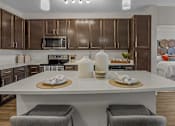Thumbnail 5 of 38 - a kitchen with brown cabinets and a white counter top