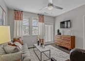 Thumbnail 6 of 38 - A living room with ceiling fan