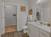 Thumbnail 12 of 38 - a bathroom with a sink and a toilet and a shower