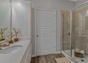Thumbnail 11 of 38 - a bathroom with a sink and a shower
