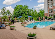 Thumbnail 14 of 38 - our apartments offer a swimming pool with lounge chairs