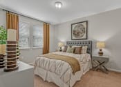 Thumbnail 9 of 38 - a bedroom with a bed and two windows