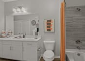 Thumbnail 10 of 38 - a bathroom with vanity, toilet and tub