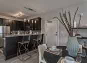 Thumbnail 4 of 29 - Modern Kitchen with Stainless Appliances at Flats on 4th Apartments in Birmingham, AL