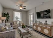 Thumbnail 1 of 29 - Living room with patio access at Flats on 4th Apartments in Birmingham, AL