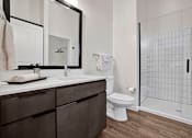 Thumbnail 17 of 55 - A bathroom with standing shower and tile surround and a white countertop