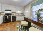 Thumbnail 4 of 32 - Kitchen with backsplash at Ascent Jones Apartments in Huntsville, Alabama
