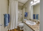 Thumbnail 9 of 32 - bathroom with wood-style floors at Ascent Jones Apartments in Huntsville, Alabama