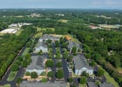 Thumbnail 25 of 25 - a birds eye view of a neighborhood with houses and trees
