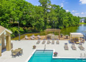 Thumbnail 11 of 34 - an aerial view of a swimming pool and patio with lounge chairs