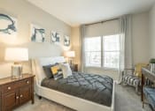 Thumbnail 11 of 25 - a bedroom with a bed and a window