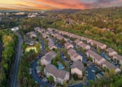 Thumbnail 25 of 25 - an aerial view of a neighborhood with houses and trees