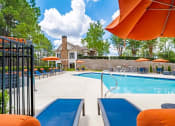 Thumbnail 22 of 35 - our apartments have a resort style pool and lounge chairs