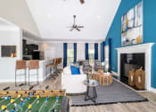 Thumbnail 16 of 35 - a living room with a pool table and a bar