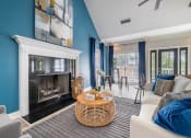Thumbnail 15 of 35 - a living room with blue walls and a fireplace